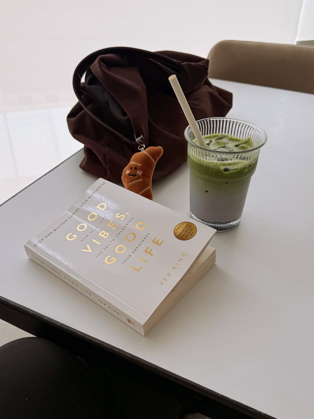 Matcha and a book at a cafe